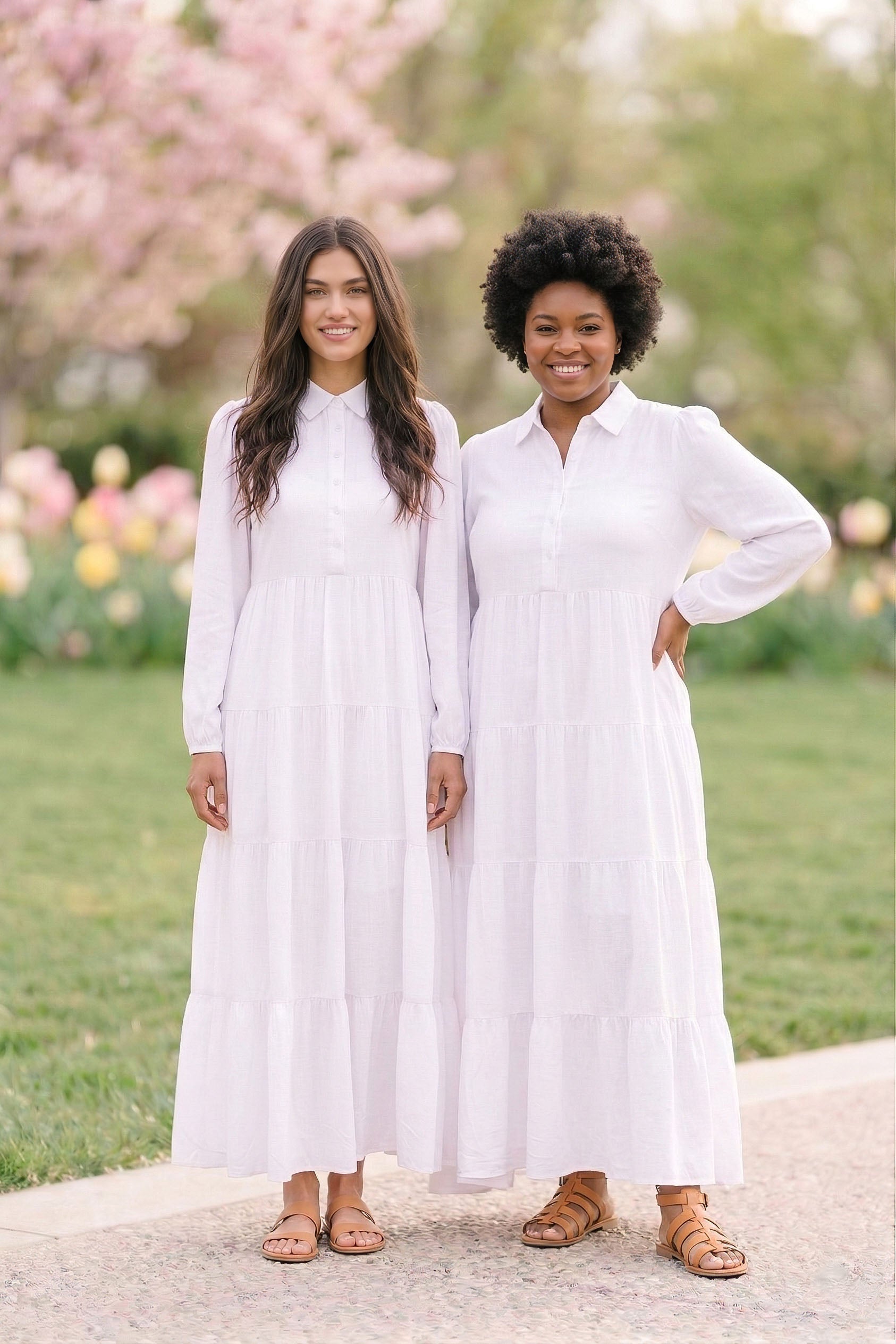 A woman wearing The Provo City Temple Dress — a modest white long-sleeve temple dress with pointed collar and four-tier skirt