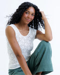 White lace scoop-neck cap-sleeve tee with a fitted silhouette