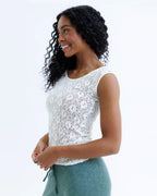 White lace scoop-neck cap-sleeve tee with a fitted silhouette