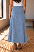 Light wash denim A line midi skirt close up showing diagonal seam detail