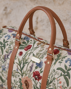 Morning Garden floral temple duffle bag with faux-leather handles and a removable strap