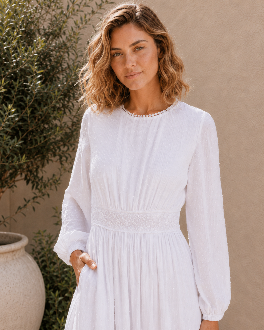 The Rome white Swiss-dot lace LDS temple dress with bishop sleeves and a tiered skirt