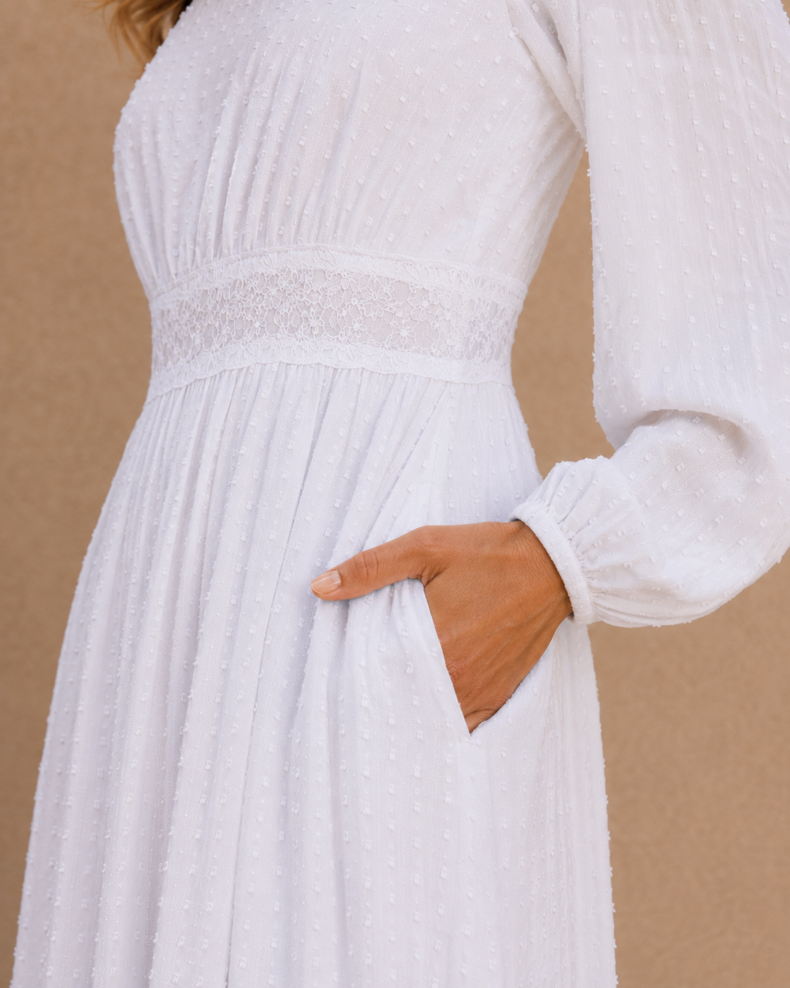 The Rome white Swiss-dot lace LDS temple dress with bishop sleeves and a tiered skirt