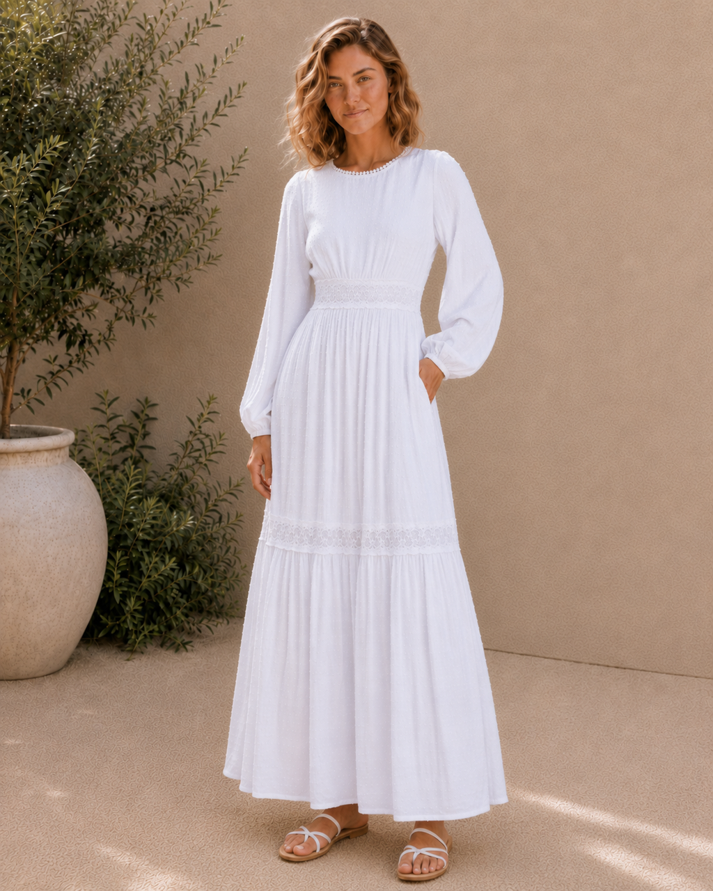 The Rome white Swiss-dot lace LDS temple dress with bishop sleeves and a tiered skirt