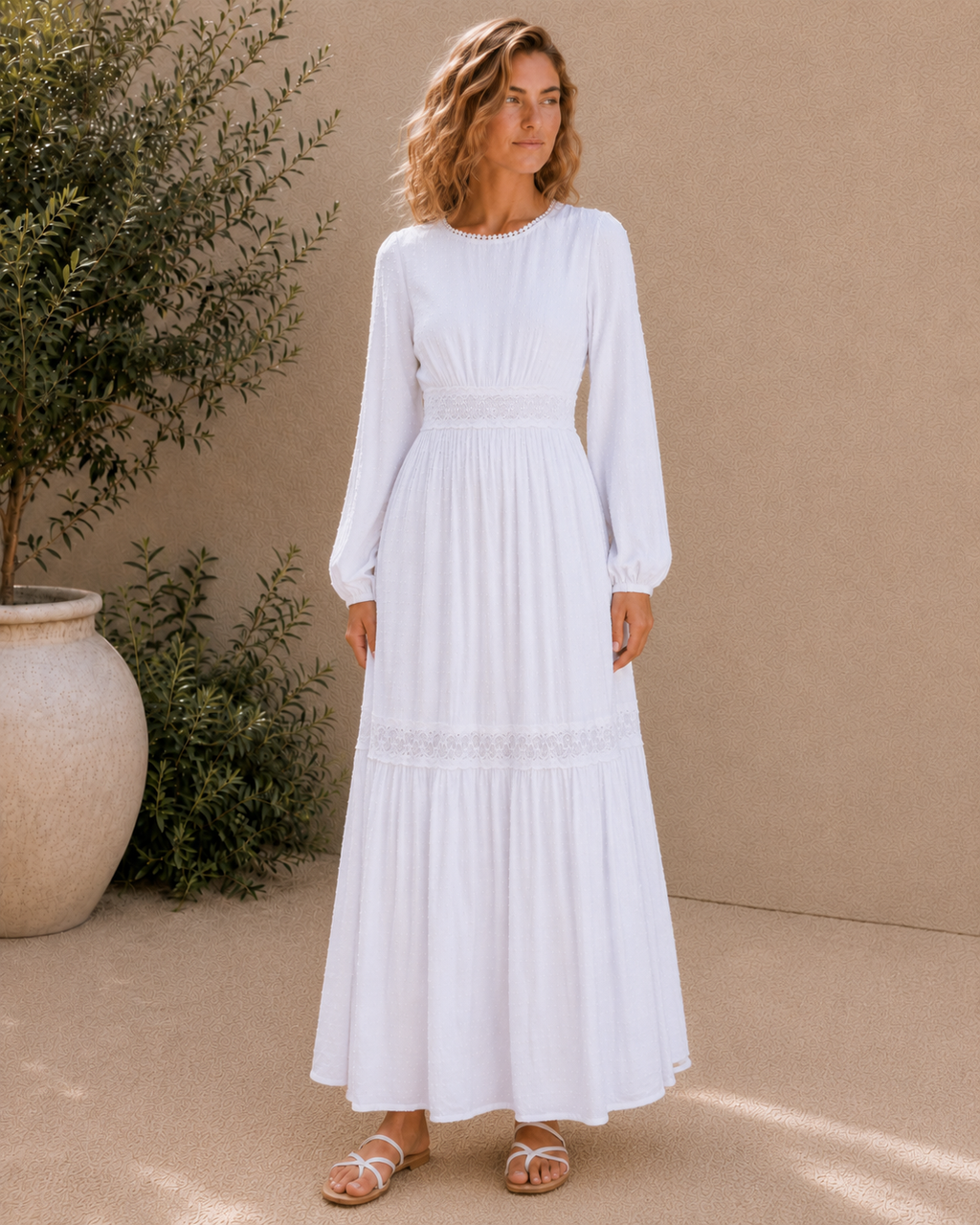 The Rome white Swiss-dot lace LDS temple dress with bishop sleeves and a tiered skirt
