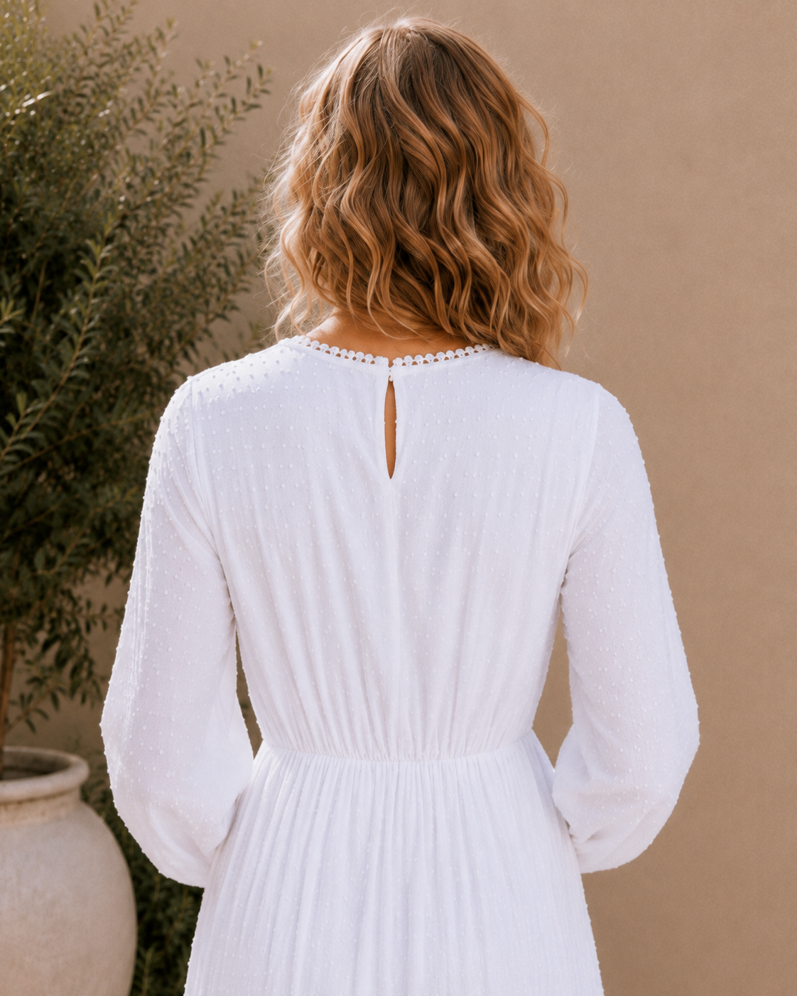 The Rome white Swiss-dot lace LDS temple dress with bishop sleeves and a tiered skirt
