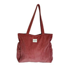 Coral corduroy shoulder bag with side pockets and top zip, made in Spain