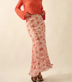 The Crimson Garden red floral-mesh modest maxi skirt with a mermaid silhouette and godet pleats