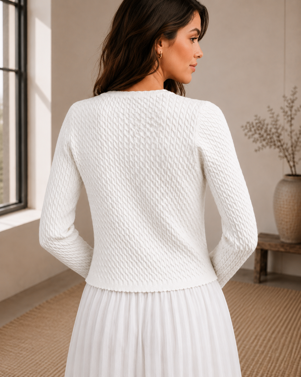 Back view of ivory textured knit cardigan showing raised allover knit texture